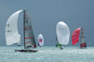 America's Cup Class yachts flying spinnakers in Louis Vuitton Act 13.
