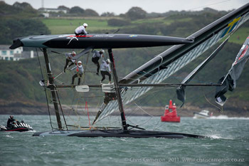 Artemis Capsized and was able to right their boat, but did not finish in time.  Photo:2011 Chris Cameron/ETNZ