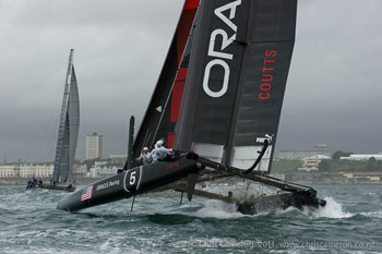 Russell Coutts gets his cat into a nose-down attitude.  OR5 had OCS problems in Race 1.  Photo:2011 Chris Cameron/ETNZ