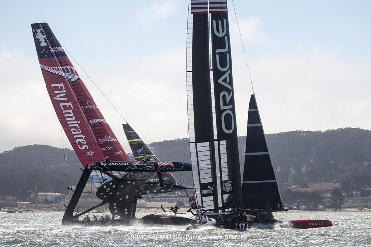 Emirates Team New Zealand and Oracle Team USA race in the 2013 America's Cup.  Click image to  read more.  Photo:©2013 Guilain Grenier