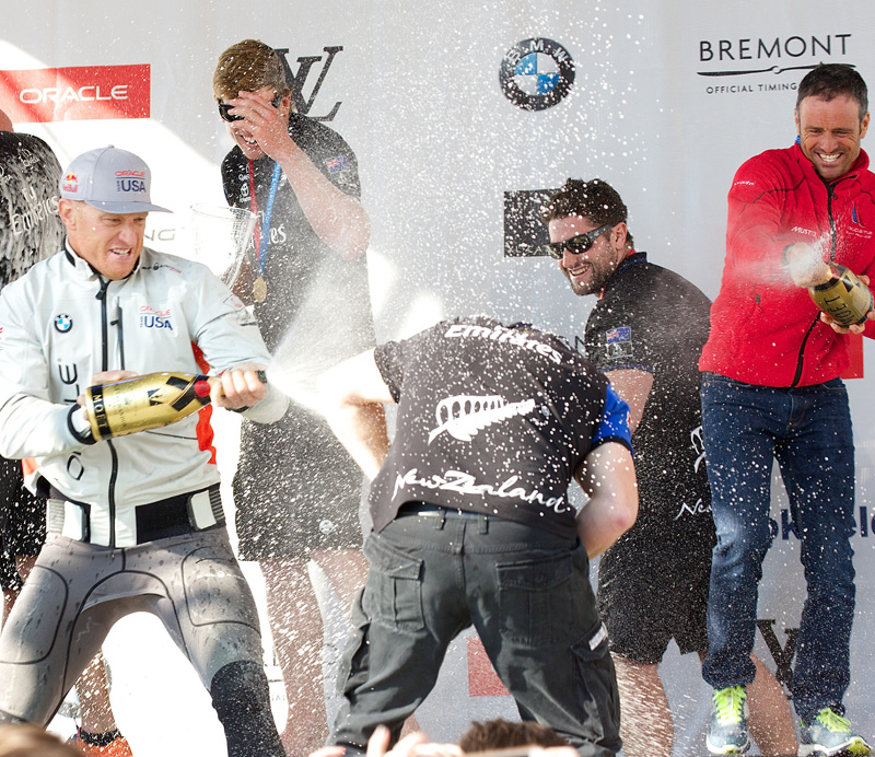 Skippers help each other cool down after the races. Oracle's Jimmy Spithill, left, ETNZ's Peter Burling, center, and Groupama Team France's Franck Cammas, right.