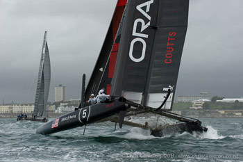 Russell Coutts gets his cat into a nose-down attitude. OR5 had OCS problems in Race 1. Photo:©2011 Chris Cameron/ETNZ