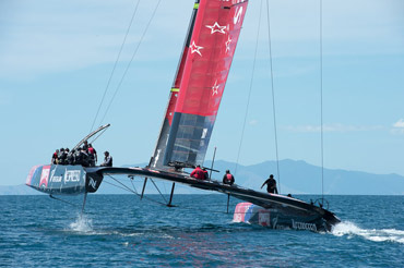 Boat 2 lifts off.  Photo:©2012 Chris Cameron/ETNZ